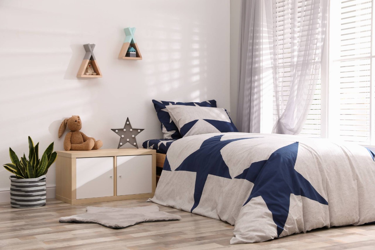 A star-themed child's bedroom with drapes and blinds for kid's rooms on the window at Midwest Blind & Shade near Mishawaka, Indiana (IN)