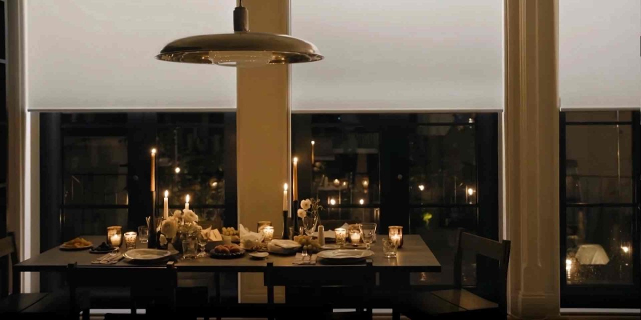  Hunter Douglas Aura® Illuminated Shades on large windows in a dining room set for romantic dinner near Mishawaka, IN